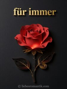 Eine kunstvoll gefaltete rote Rose mit goldenen Blättern und Stielen, beleuchtet, mit der Aufschrift „für immer“.